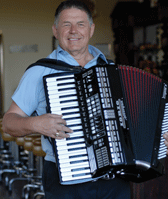 Harvey Schilling taps a German tune on the accordian